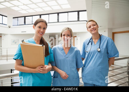 Three nurses in stairwell Stock Photo