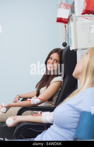Two patients receiving a transfusion Stock Photo