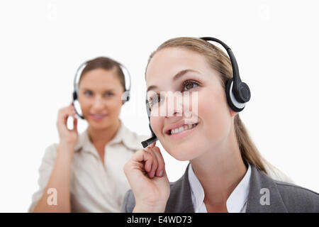 Smiling operators using headsets Stock Photo