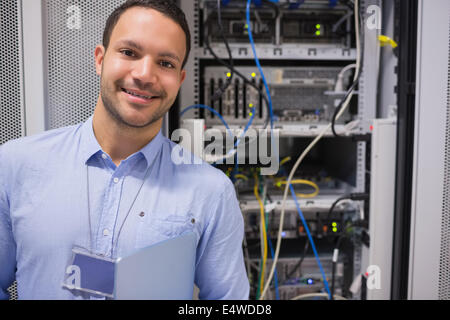 Man smiling in front of the servers Stock Photo