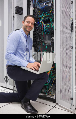 Man doing maintenance at the data store Stock Photo
