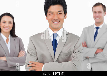 Smiling salesteam with arms crossed Stock Photo