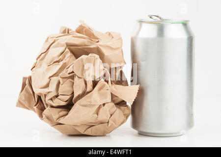 Empty can and crushed paper bag Stock Photo - Alamy