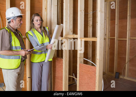 Architects studying the plan Stock Photo