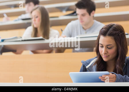 Student using tablet pc to take notes Stock Photo