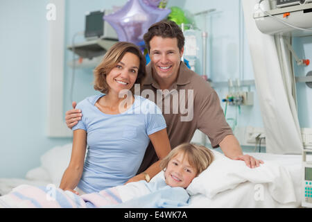 Parents next to their son Stock Photo