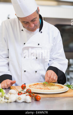 Happy chef making pizza Stock Photo