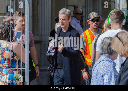 Cardiff, Wales, UK. 17th July, 2014. Peter Capaldi on the set of Doctor Who, filming on Queen Street, Cardiff Credit:  Owain Thomas Alamy Live News Stock Photo