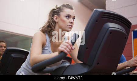 Woman riding in a spinning class Stock Photo