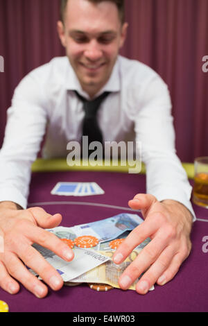 Man is happy grabbing money Stock Photo