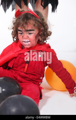 Little boy dressed as devil Stock Photo