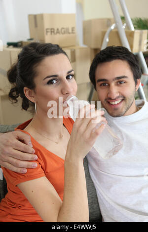 woman drinking water from bottle Stock Photo