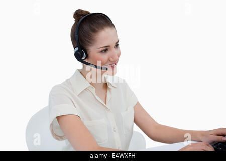 Secretary talking through a headset Stock Photo