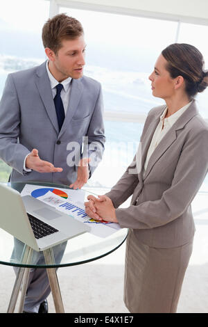 Market analysts talking about results Stock Photo