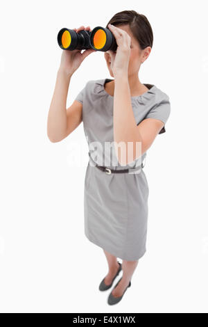 Woman using spyglasses Stock Photo