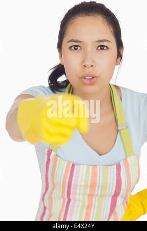 Accusing woman in apron pointing Stock Photo