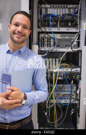 Man standing in front of servers Stock Photo