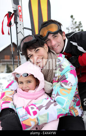 Young family on skiing holiday Stock Photo