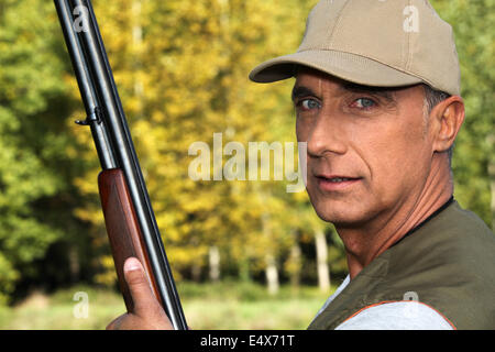 Hunter with a shotgun Stock Photo