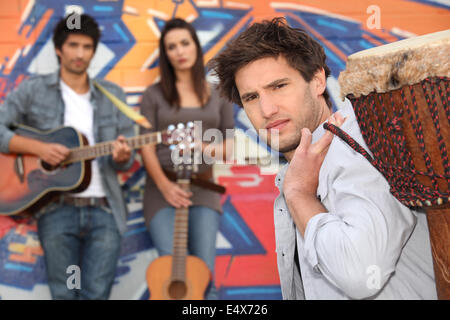 Young people with guitars and drums Stock Photo