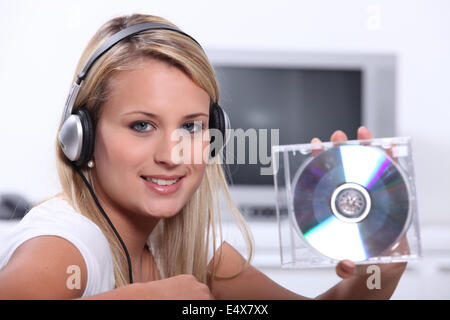 Blond woman listeing to music Stock Photo