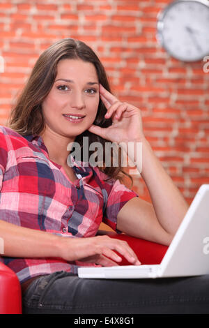 Woman using a laptop Stock Photo