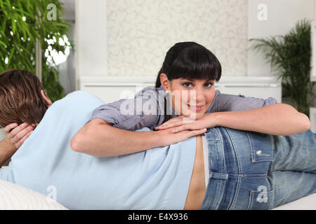 Woman lying on her boyfriend Stock Photo