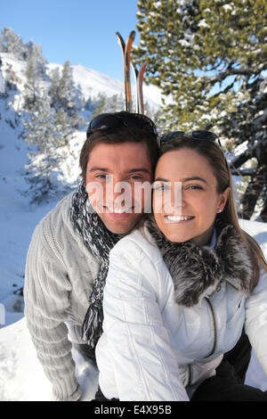 Portrait of a couple skiing in the Alps Stock Photo