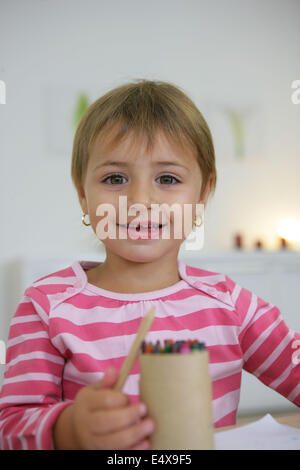 Little girl coloring in Stock Photo