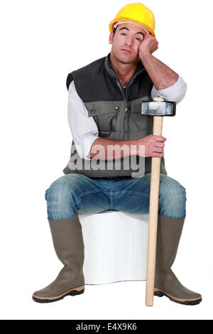 Bored construction worker Stock Photo