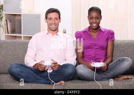 Couple playing computer games Stock Photo