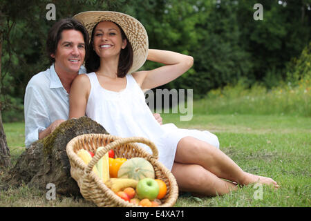 Couple having  vegetarian picnic. Stock Photo