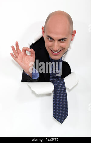Businessman giving the OK sign Stock Photo