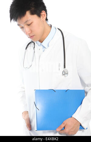 Worried Asian young male doctor looking down Stock Photo