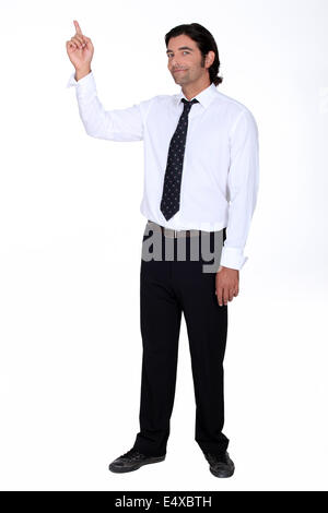 Man in a shirt and tie pointing upwards Stock Photo