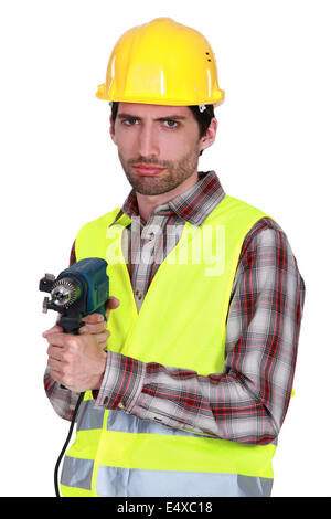 Portrait of a frowning tradesman Stock Photo