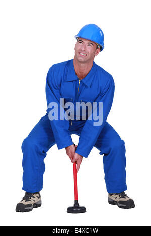 Plumber with plunger Stock Photo