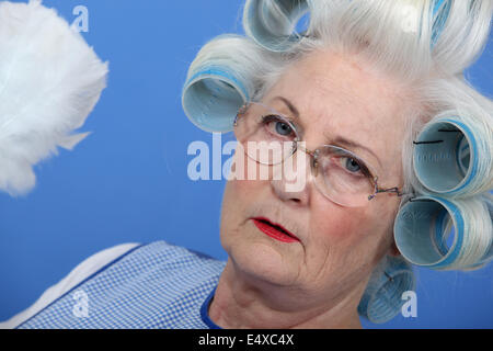 Granny with her hair in rollers Stock Photo