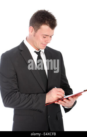Businessman writing notes on clipboard Stock Photo - Alamy