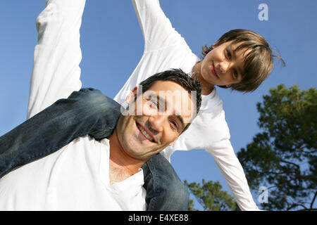 boy on his father's shoulders Stock Photo