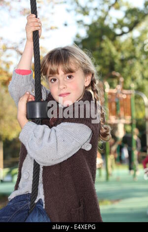 small girl in roundabout Stock Photo