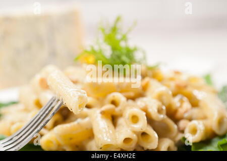 Italian pasta penne gorgonzola and pine nuts Stock Photo