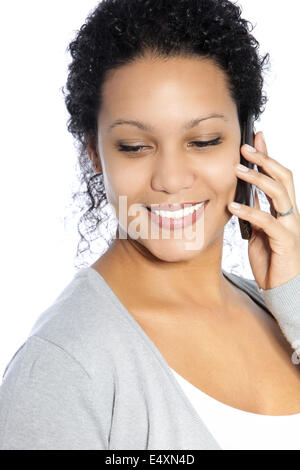 Smiling woman talking on her phone Stock Photo