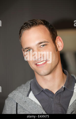 Blue eyed handsome confident young man Stock Photo