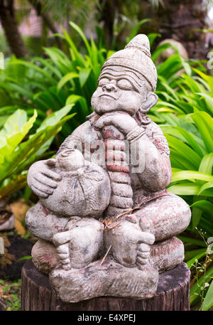 Thai religious statue in the green Stock Photo