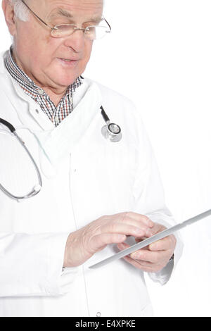 Senior doctor working on a tablet Stock Photo