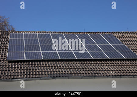 Solar panels on a house roof Stock Photo