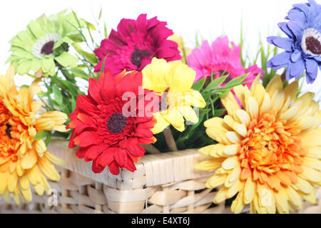 Bright summer flowers in a basket Stock Photo