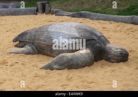 Wooden sea turtle in the sandbox. Stock Photo