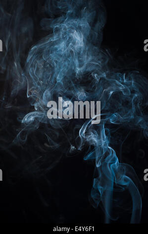Moving smoke on a black background Stock Photo
